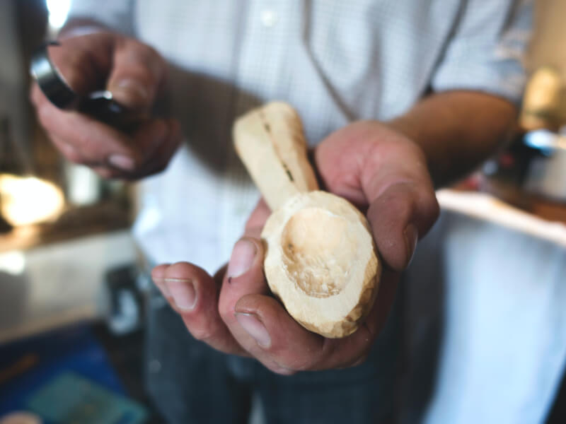 Man carving a wooden spoon
